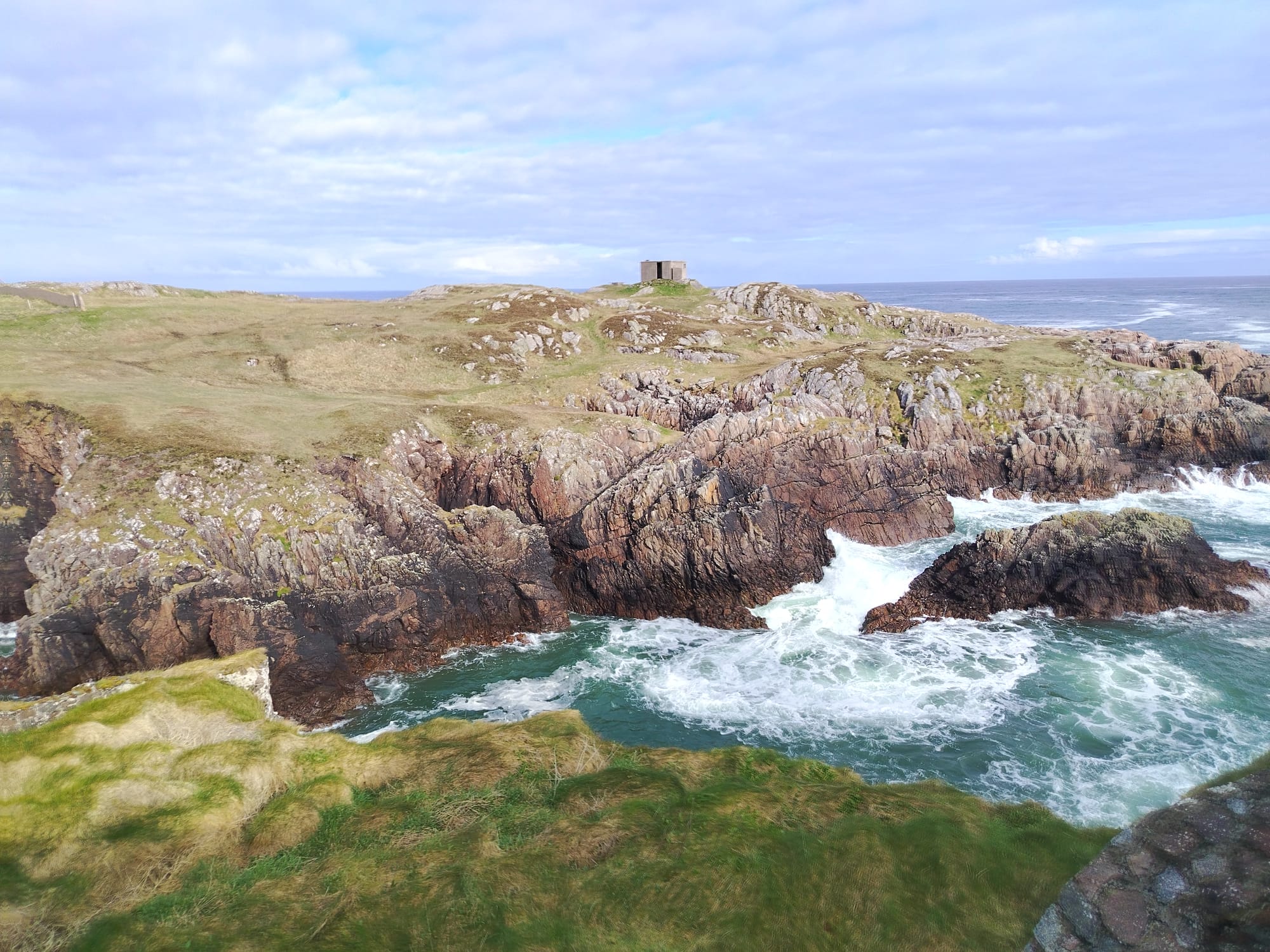 Rocky Donegal coastline with crashing waves
